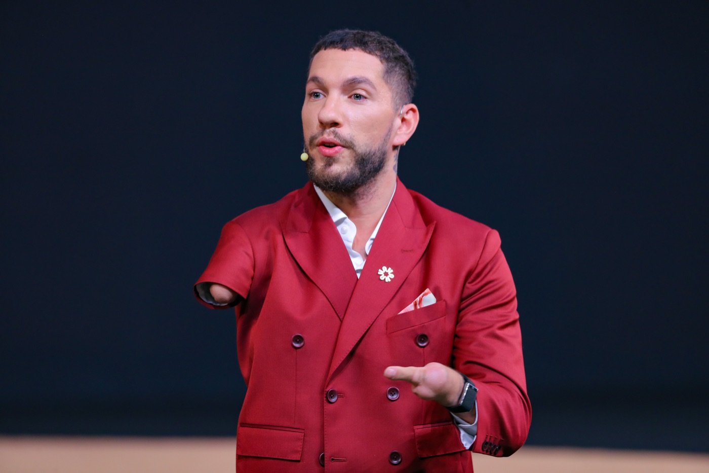 Nick Santonastasso speaking on stage